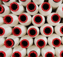 A stack of nylon webbing rolls.