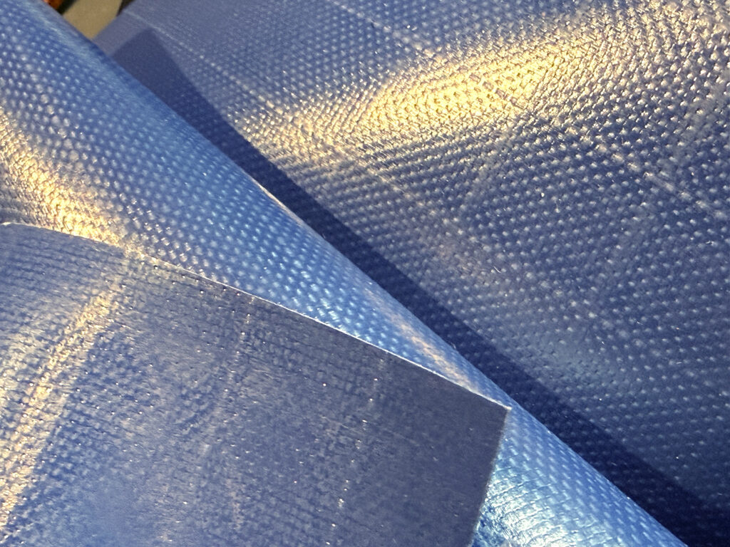 Textured navy blue ripstop fabric, showcasing multiple overlapping layers.