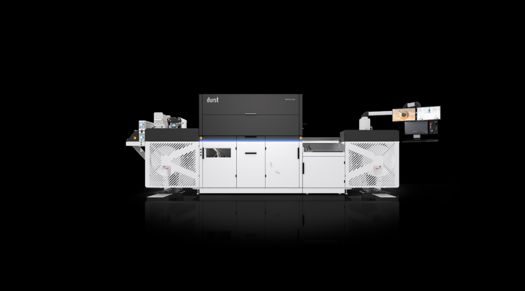 A digital printing system in black and white with a sleek design, featuring a front display and various operational components, set against a black background.