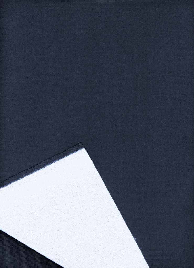 Deep navy fabric with a glossy finish, featuring a folded edge revealing a contrasting white underside.